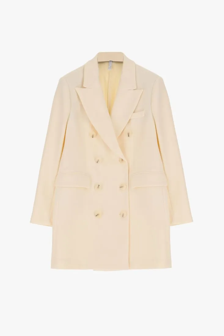 Cappotto lungo doppiopetto monocolour con revers a lancia